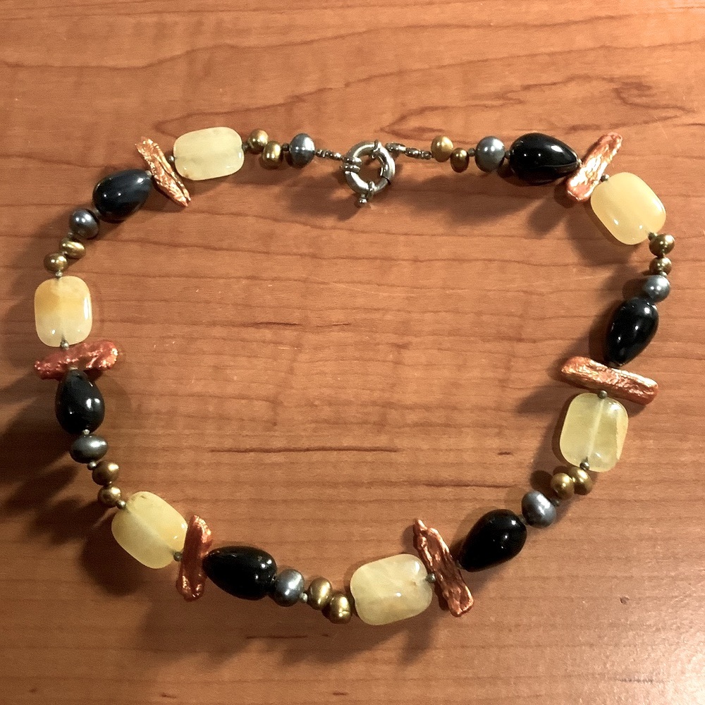 Lovely designed necklace  of different shape and color beads and stones